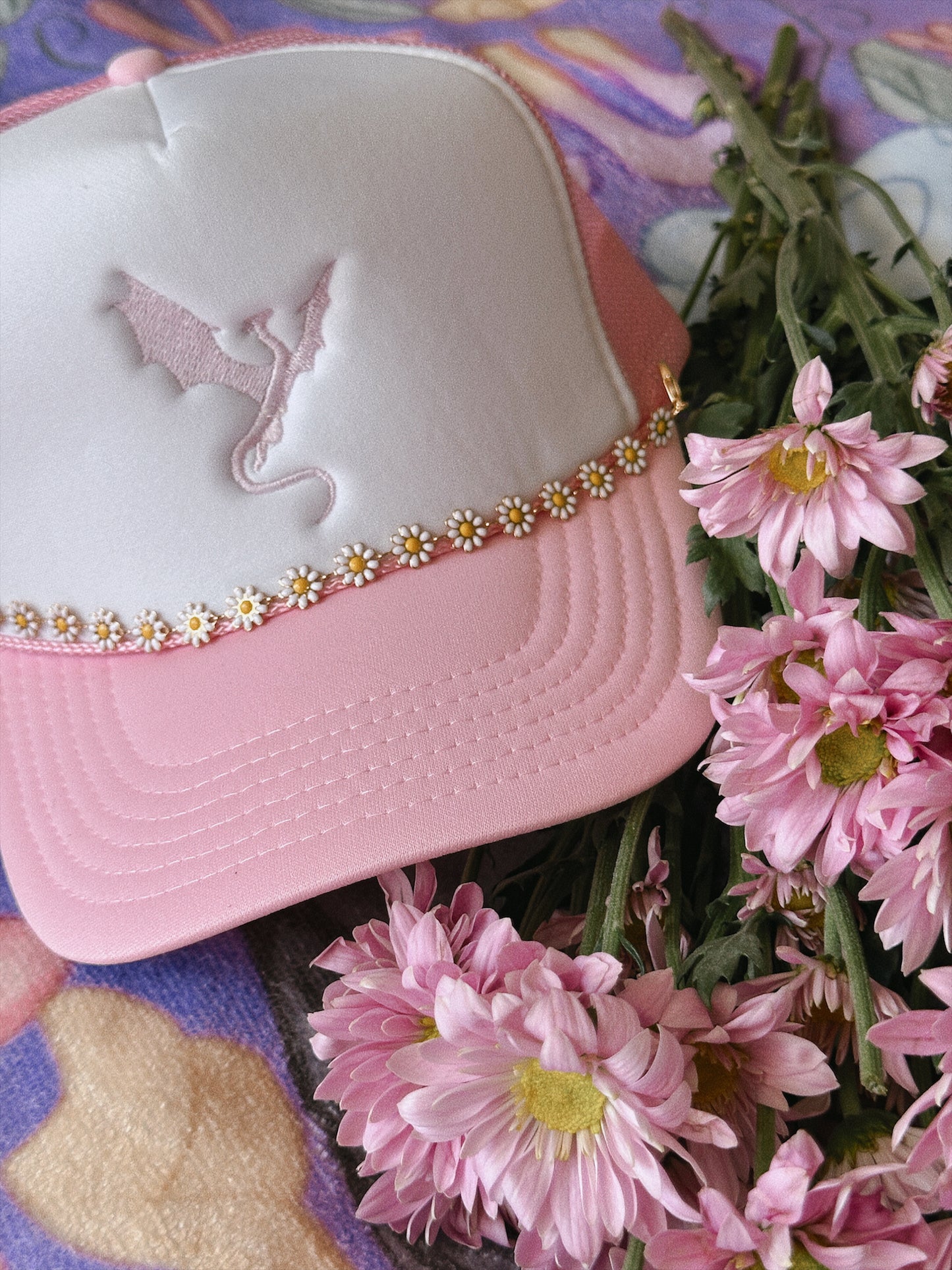 THE FLOWER-LOVING WYVERN TRUCKER HAT