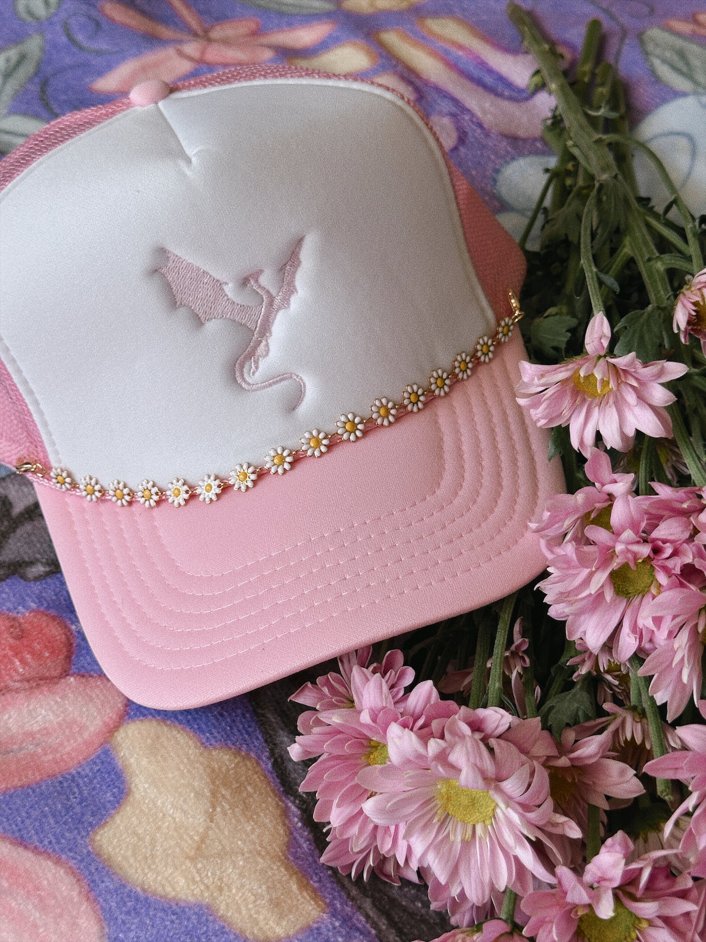 THE FLOWER-LOVING WYVERN TRUCKER HAT