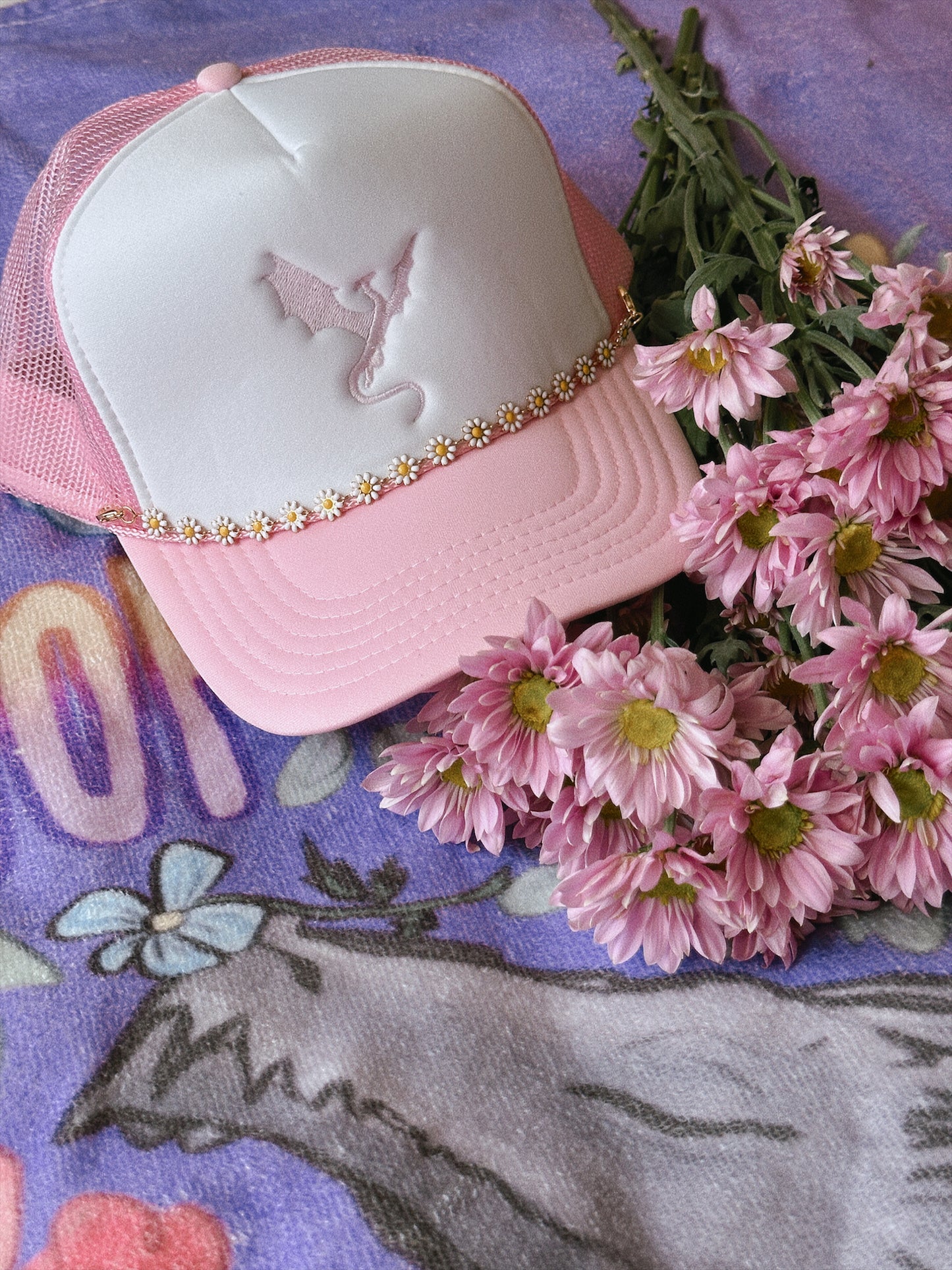 THE FLOWER-LOVING WYVERN TRUCKER HAT