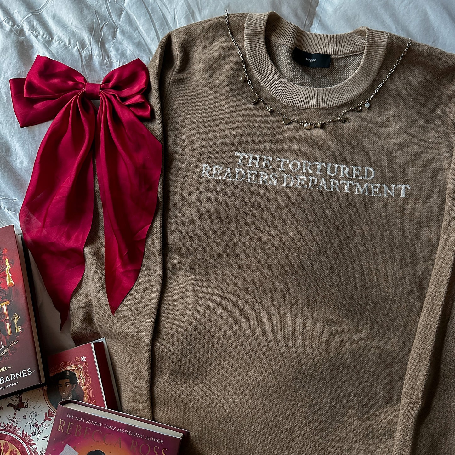 TORTURED READER KNIT SWEATER