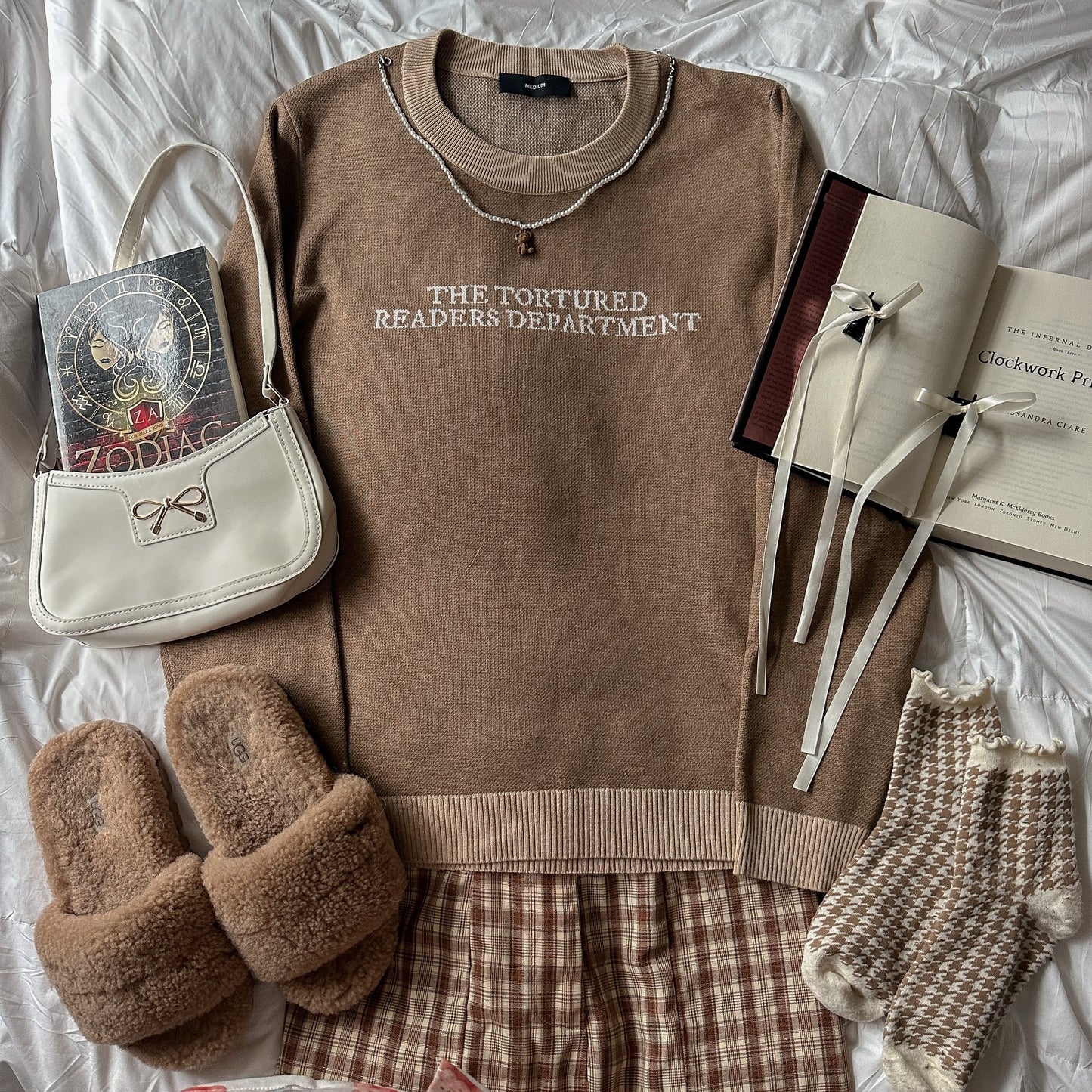 TORTURED READER KNIT SWEATER