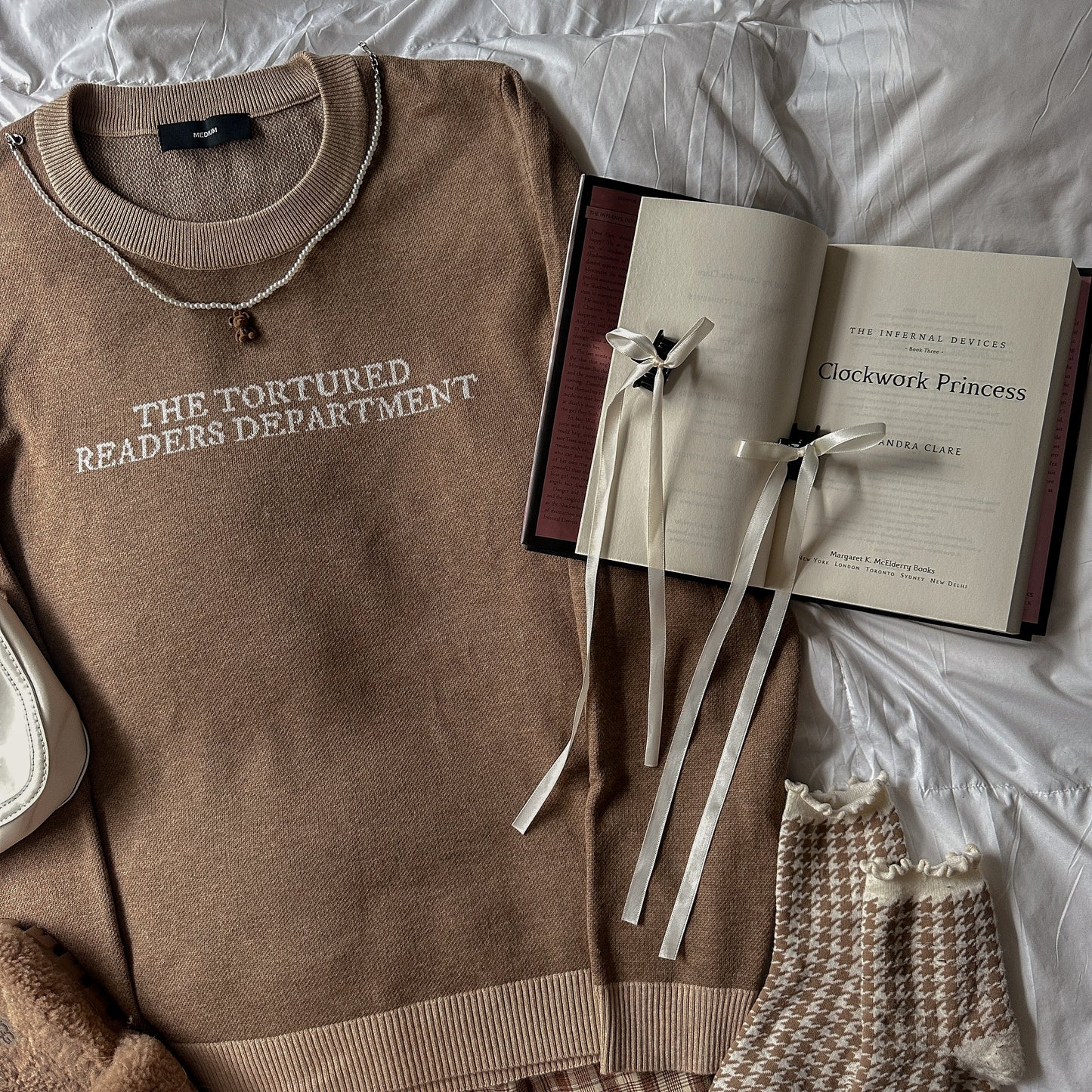 TORTURED READER KNIT SWEATER