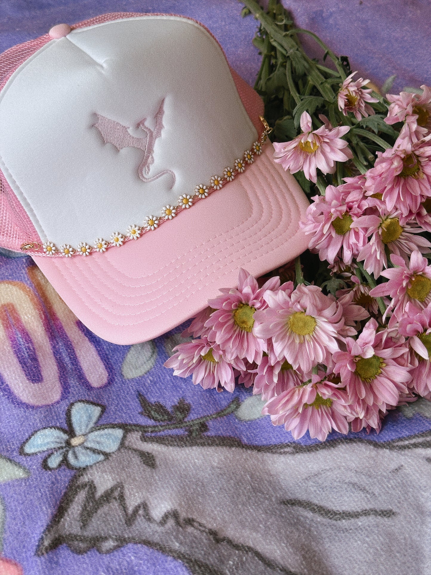 THE FLOWER-LOVING WYVERN TRUCKER HAT